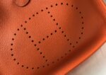 hermes clemence evelyne pm 25cm orange feu xt2en.jpeg
