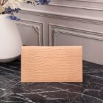 saint laurent embossed monogram uptown pouch beige 27cm zfdoo.jpg