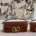 valentino garavani loc shoulder bag in pleated nappa brown 5ybki.jpg