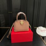 valentino garavani rockstud handbag in grainy leather light pink 21cm dfwvt.jpg