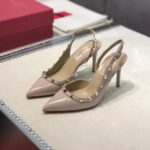 valentino garavani rockstud patent leather strap pump beige ehhsy.jpg