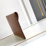 valentino garavani rockstud raffia clutch bag in brown 28cm l3z2z.jpg